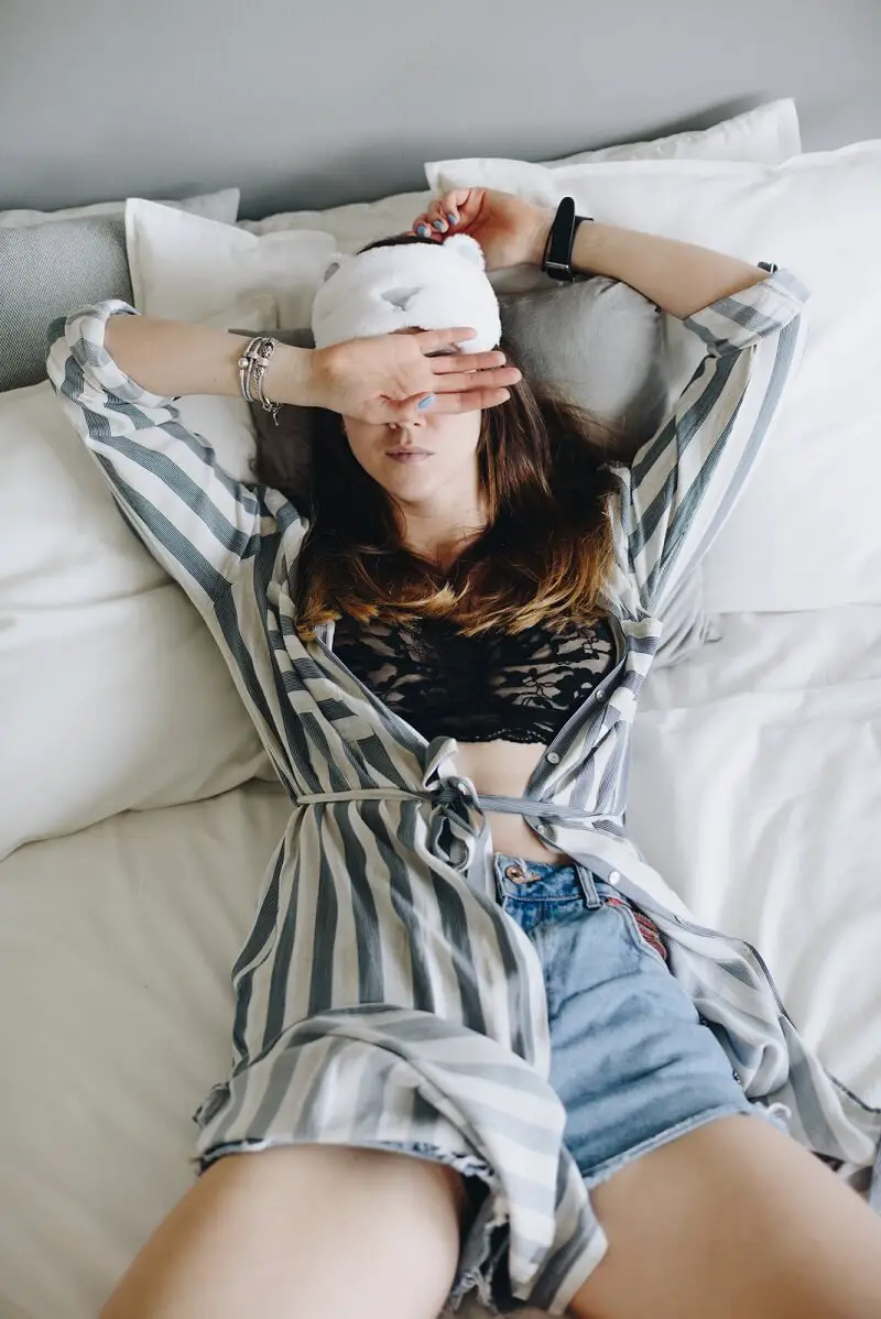 fashionable woman sleeping on her back