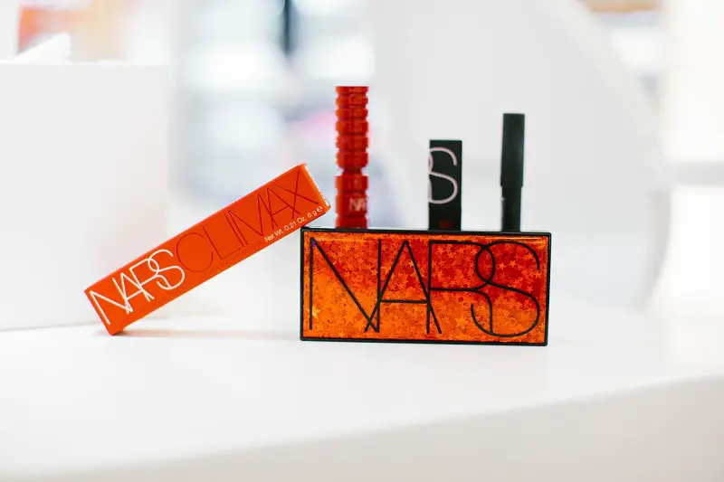 close-up of NARS Climax Mascara boxes and tubes on a white background