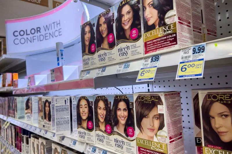 boxed hair dye conditioner for sale inside a Rite Aid Pharmacy